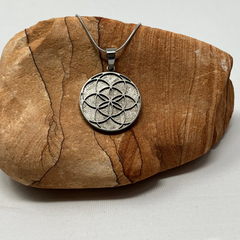Meteorite Pendant with Celestial Flower