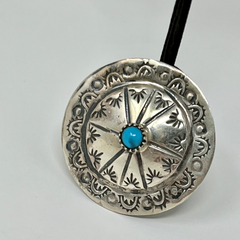 Round sterling silver and turquoise hand stamped pin.